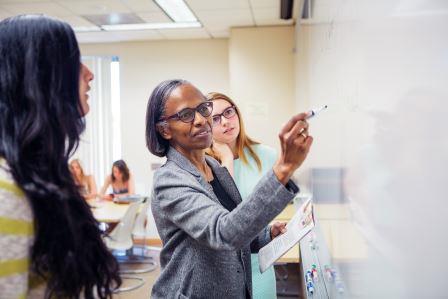 Students and Faculty at the whiteboard